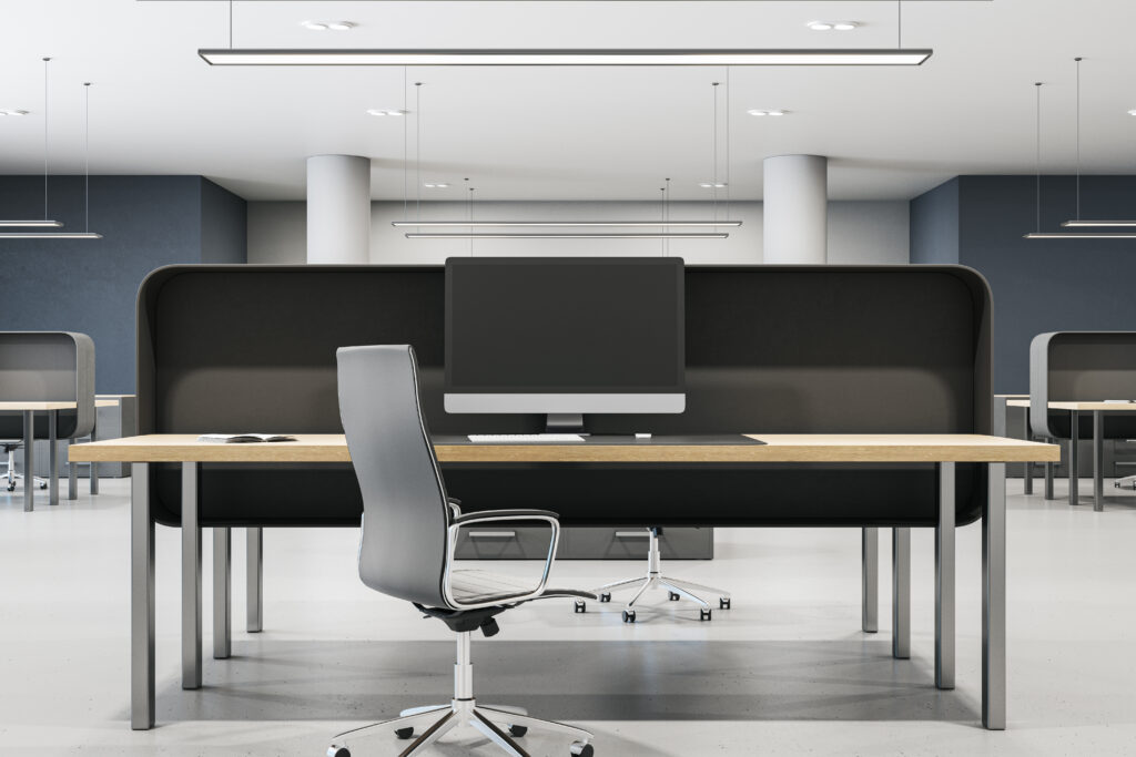 Contemporary coworking office interior with furniture, empty computer monitors and concrete flooring. Mock up, 3D Rendering.